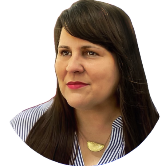 Photo of Holly. Long straight dark hair and dark eyes, olive skin, striped shirt.